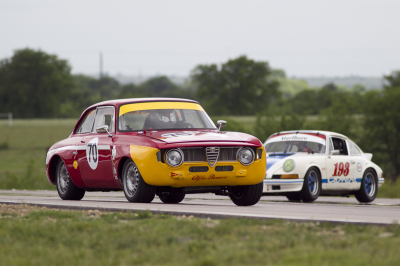Scott Conrad and his 1968 Alfa Romeo GT Jr being chased by Jose Miguel Iturbe in his 1972 Porsche 911