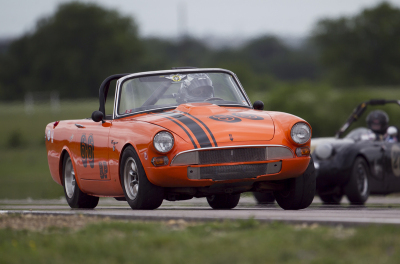 Glen Valdes and his 1966 Sunbeam Tiger hold off Jeff Walker and his 1961 Austin Healey Sprite