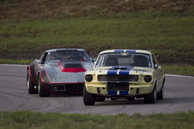43 John Bergendahl in his 1966 Ford Mustang dicing with 28 Mark Hilderbrand and his 1972 Chevy Corvette