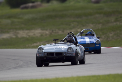Don Couch in his 1962 Triumph Spitfire followed by Bobby Whitehead in his 1973 MG Midget