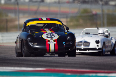 Marcus Pillion and his ominous Porsche 356B Coupe leading over Paul Konkle Jr in his 1962 MG B
