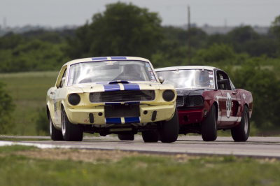 John Bergendahl in his 1966 Ford Mustang with 90 David Lasco in his 1965 Ford Shelby GT350 looking for a way past